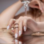Beautiful manicure on the nails of a woman. Color coloring of the nails on the hand. Gentle, well