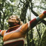 Freedom and happiness lifestyle and moment. Standing middle age young woman