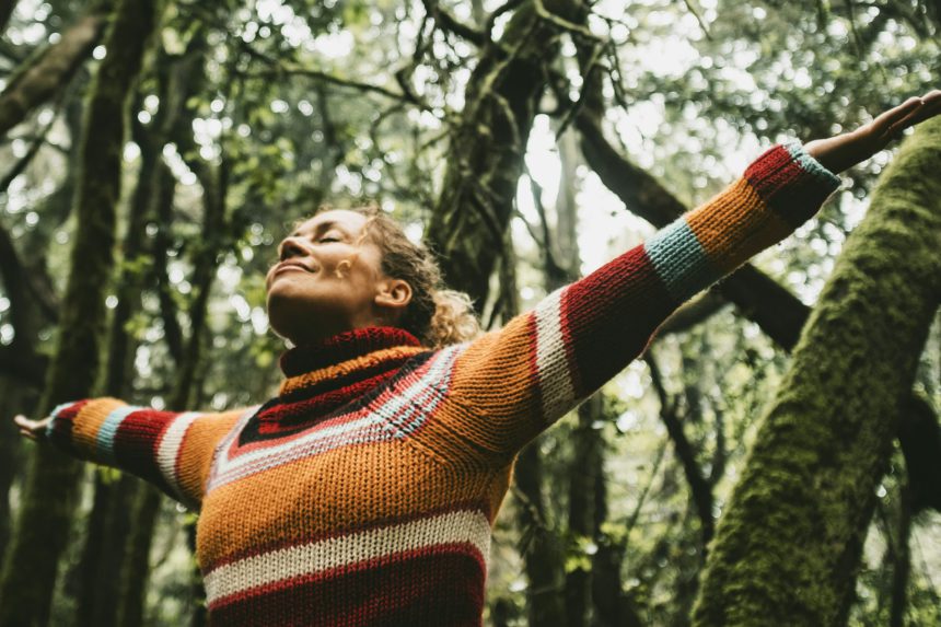 Freedom and happiness lifestyle and moment. Standing middle age young woman