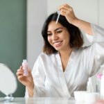 Pretty middle eastern brunette woman having face care routine