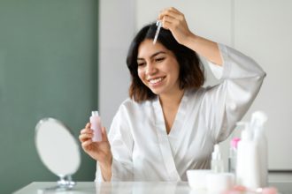 Pretty middle eastern brunette woman having face care routine